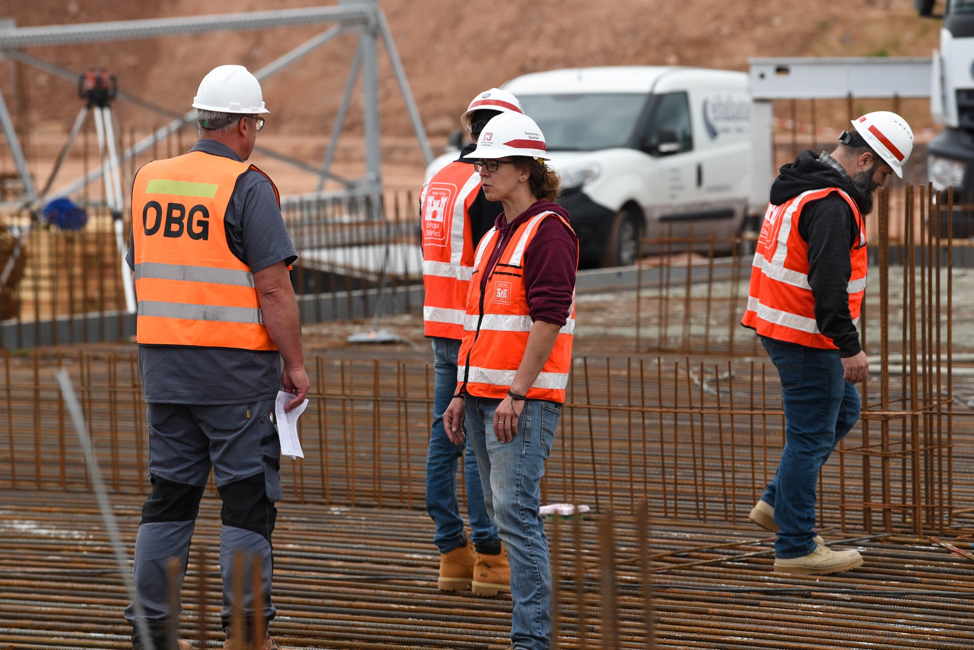 Construction crew working around reinforcing steel